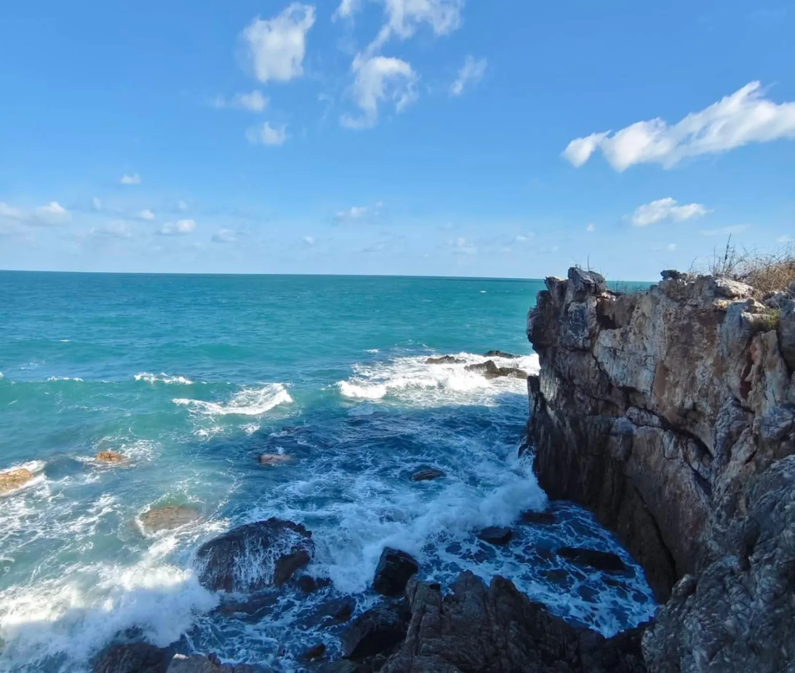 The rocky headland and open sea seen from the island viewpoint path