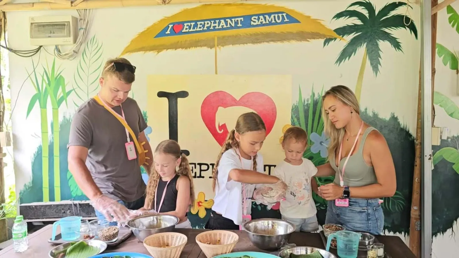 Guests preparing food for the elephants in the nursery kitchen
